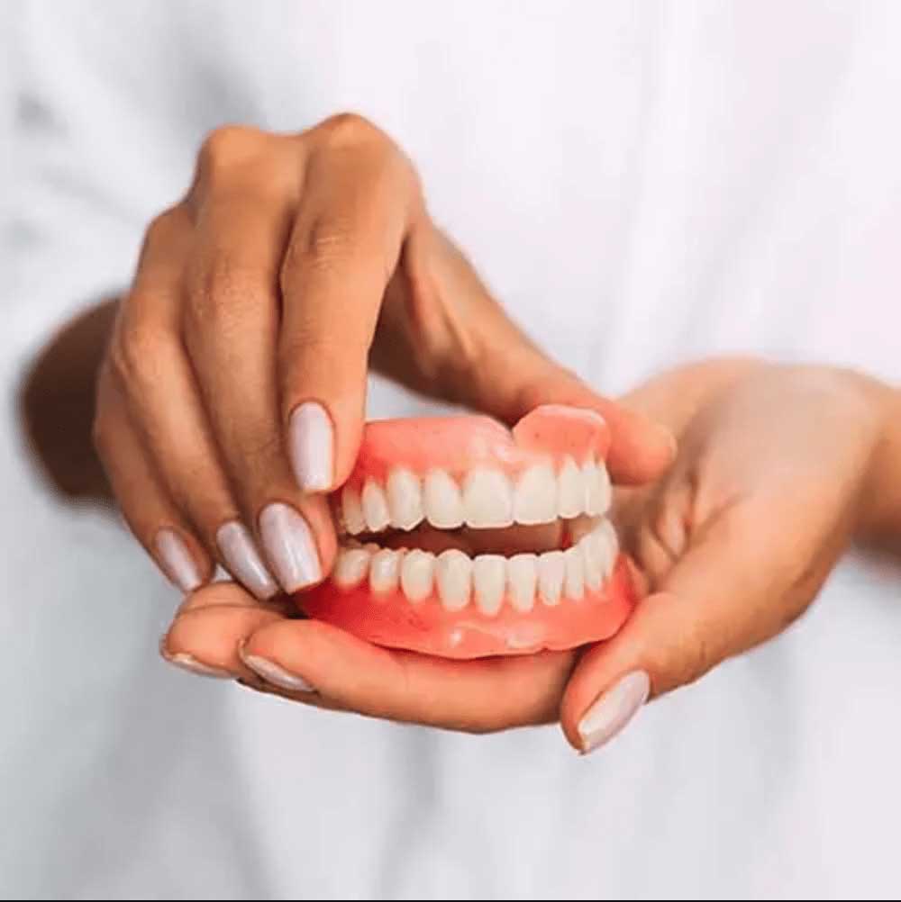 Traditional Dentures being shown to patient